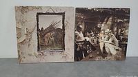 Front covers of two Led Zeppelin vinyl LP albums, showing distinctive original artwork.
