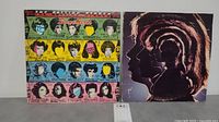 Front covers of two Rolling Stones LP albums: Some Girls with colorful collage artwork; Hot Rocks 1964-1971 with silhouette band photo.