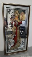 Front view of large rectangular bar mirror featuring artistic inlay of elegant woman with floral bouquet and SPRING text.