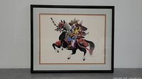 Framed embroidery artwork front view showing detailed needlework of samurai warrior on black horse.