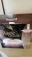 Magic Fountain in original packaging showing branding and product image.