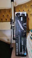 Star Finding Telescope in original box standing upright beside a white telescope tube and tripod