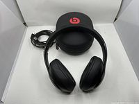 Headphones, case, and cable displayed