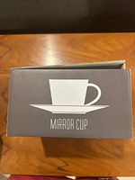 Box labeled Mirror Cup