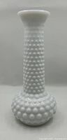full view of white hobnail milk glass bud vase