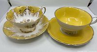 Front view of both teacup and saucer sets