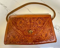 Front view showing floral tooled pattern and twist lock