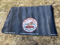 Full view of the black textured rubber tool mat with the Busted Knuckle Garage logo in the center and Fender Gripper branding on bottom left.