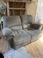 Front view of grey micro suede La-Z-Boy loveseat showing cushioned back and armrests.