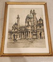 Frontal image of the framed antique hand-coloured etching showing St. Charles Church in Vienna, with visible details of the architecture under a domed roof and signed lower right.