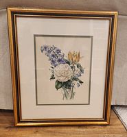 Framed vintage floral print showing overall appearance with gold frame and floral illustration