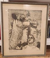 Framed print showing the full artwork with the camel and Berber girl, capturing the whole piece including background elements and frame.