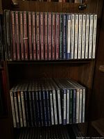 Two shelves filled with 44 classical music CDs in cases, mainly Naxos Historical label.