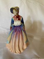 Front view of the Lady Christine figurine showing detailed clothing and facial features.