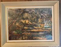 Front view of framed artwork showing Paul Cezanne print "The Brook". Wooden frame with beige and gold trim.