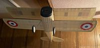Top view of the SPAD French WWI biplane model airplane showing the balsa wood frame with tissue covering, with French roundel markings on the wings.