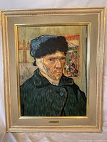 Full view of the framed print showing Van Gogh's self-portrait with bandaged ear in a golden decorative frame.
