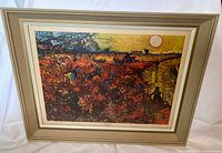 Full view of the framed print showing the artwork and the off-white wooden frame.