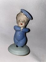 Front view of the Wade ceramic figurine of a sailor child, showing detailed facial features and blue sailor outfit.