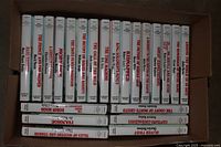 Photo of 21 Great Illustrated Classics children's paperback books neatly lined up vertical showing spines with titles and authors.