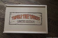 Closed wooden sliding box with 'Tumble Tree Timbers Limited Edition' logo on top.
