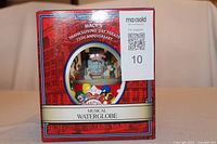 Box of Macy's 75th Anniversary Thanksgiving Day Parade Musical Water Globe showing front and branding.