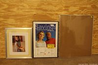 Three frames side by side: left has 17x20 with photo, center 22x28 with promotional poster, right 16x24 empty with cardboard backing