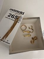 Box with ring and five pairs of earrings, gold tone and pearl-like studs