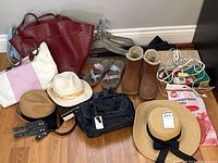 Photo showing all items arranged on the floor including multiple hats, bags, belts, boots, socks, storage boxes, hangers, and accessories.
