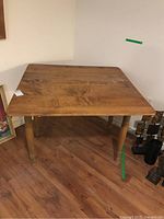 Front view of wooden table showing grain and surface wear