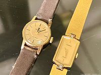 Both watches front view showing dials and cases