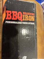Packaging of BBQ Branding Iron with 'PERSONALISE YOUR STEAK' text