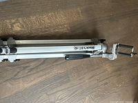 Folded Blacks BT-40 aluminum tripod showing the phone mount and flip lock leg mechanisms.