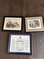 Overview photo of the three framed prints: Canadian Charter of Rights and Freedoms and two historical art prints.