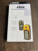 Front cover of the Garmin eTrex instructional training video. Shows the device and describes that the video includes training on features of the eTrex and eTrex Summit.