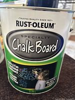 Front view of Rust-Oleum Chalkboard Paint can showing product label including brand, type, volume, and intended finish.
