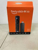 Front view of Amazon Fire TV Stick 4K Max unopened box showing streaming stick and remote picture with key features like 16 GB storage and Wi-Fi 6 support.