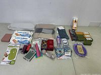 Overview of lot items displayed against a white background including various personal care, beauty, and accessory items.