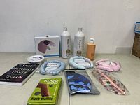 Overview of assorted personal care items, headbands, book and other accessories