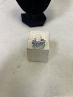 Front view of the sterling silver ring on display stand showing the oval cut cubic zirconia stone