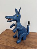 Front three-quarter view showing overall sculptural shape and painted pattern