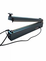 Side angle photo of the heat sealer showing the press lever arm and base unit with power cord attached.