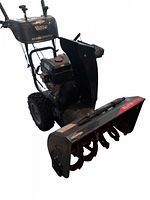 Front-right perspective of snowblower showing brand decals and overall condition