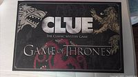 Front of the Game of Thrones Clue board game box showing sigils and title.