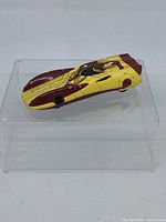 Top and angled views of the Iron Man themed Hot Wheels car showing the detailed Iron Man design and overall condition.