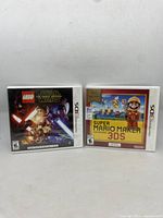 Photo showing front covers of two Nintendo 3DS game cases: Super Mario Maker 3DS and LEGO Star Wars 3DS.