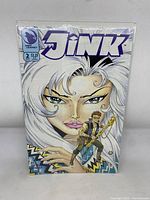 Front cover of Jink Comic Issue No. 2 showing detailed cover art of large female character with white hair and smaller male character.