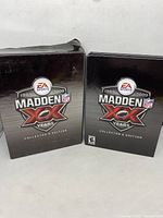 Outer box and game case of Madden NFL XX Years Collector's Edition for PS3. Outer box has visible damage at the top corner.