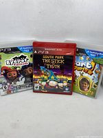 Front view of three PS3 game cases including South Park: The Stick of Truth, Start the Party! and EyePet & Friends.