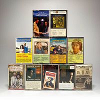 Front view of 11 cassette tapes arranged in 3 rows showing album artwork and artist names.